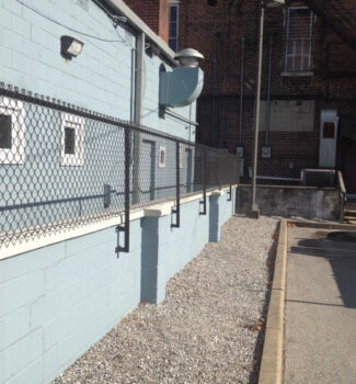 Face mounted chain link fence